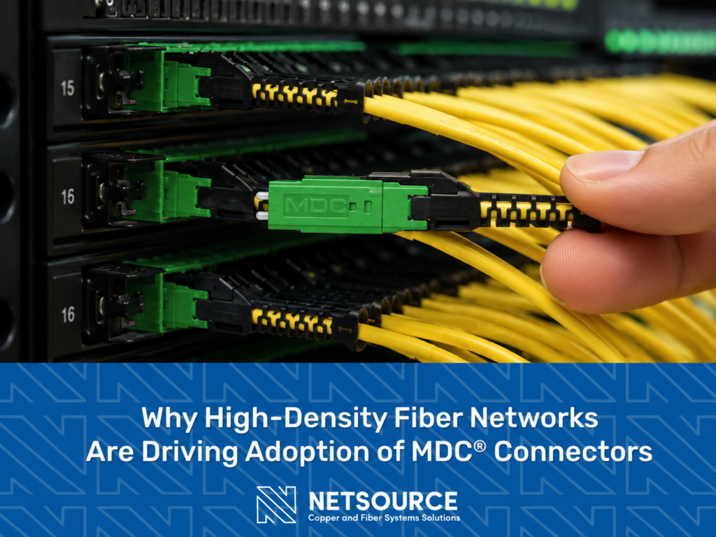 Closeup of tech inserting a MDC fiber connector into a high density patch panel. Why High-Density Fiber Networks Are Driving Adoption of MDC Connectors.