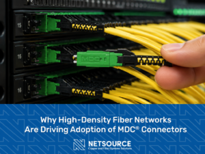 Closeup of tech inserting a MDC fiber connector into a high density patch panel. Why High-Density Fiber Networks Are Driving Adoption of MDC Connectors.